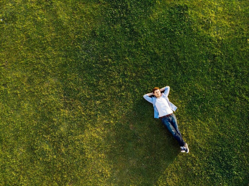 Man Laying on the Grass