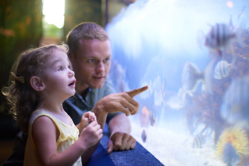 father with his daughter on ocean park