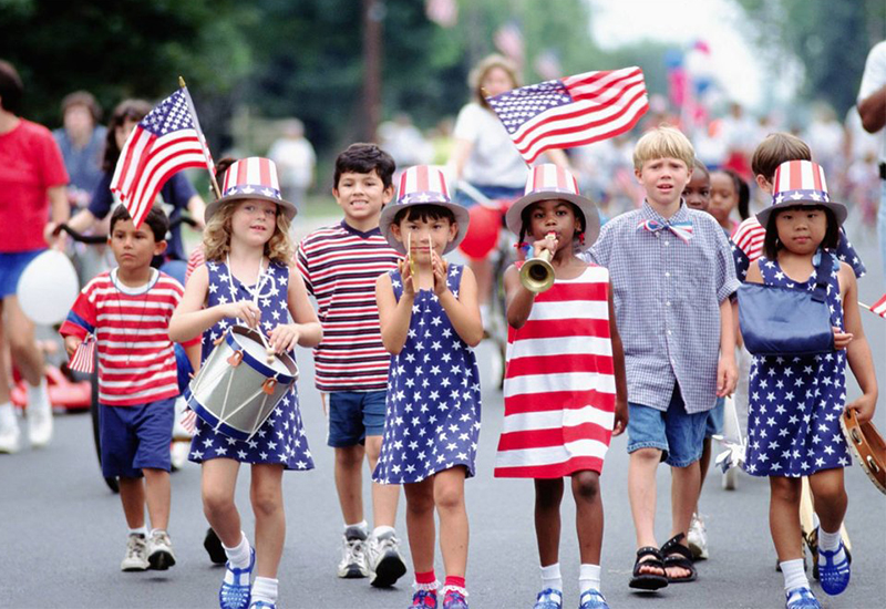 Kids showing patriotism with American flag