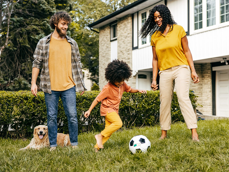 Family playing soccer