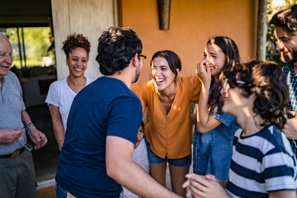 A big family smiling and talking.