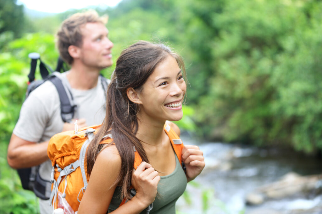 Two people hiking wearing outdoor gear