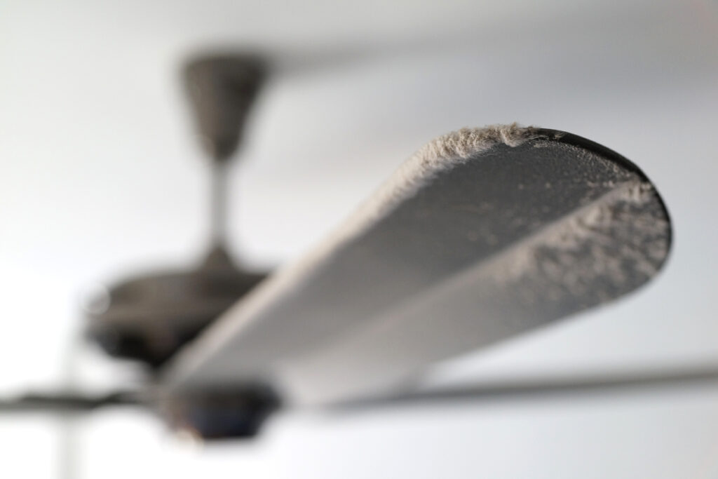Close Up Dusty Ceiling Fan With Thick Dust Blocking The Air Flow