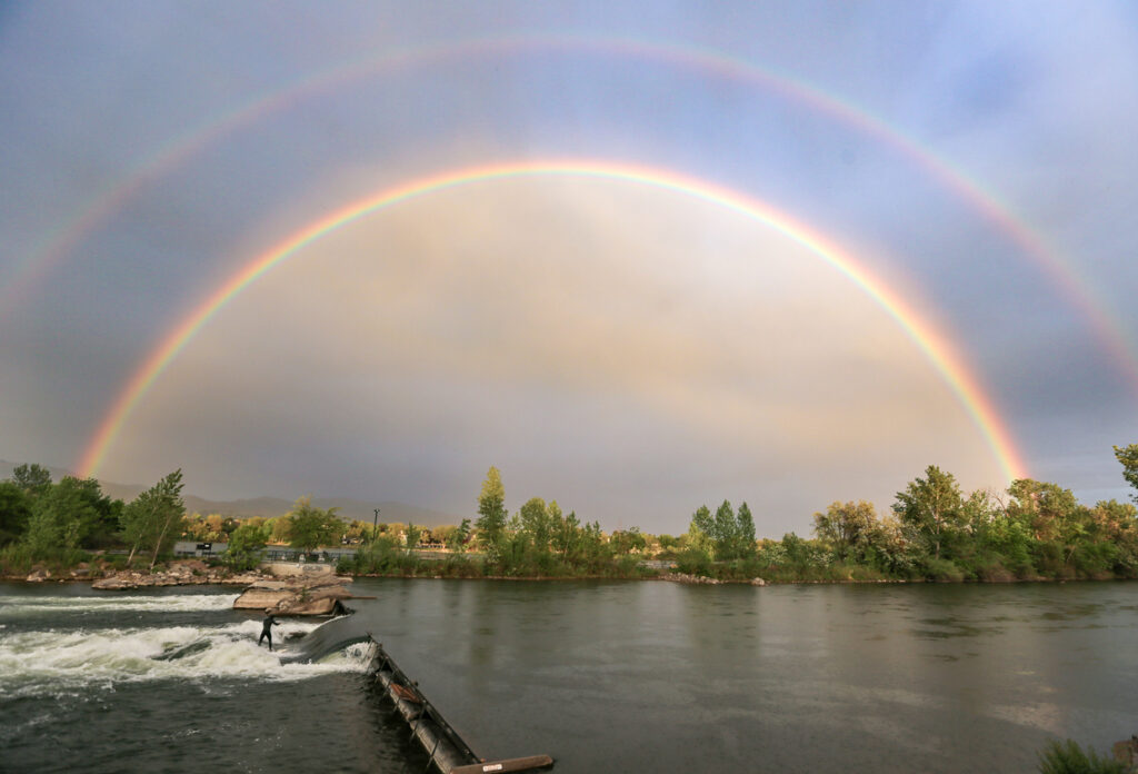 River surfing the wave on the Boise River in Boise, Idaho
