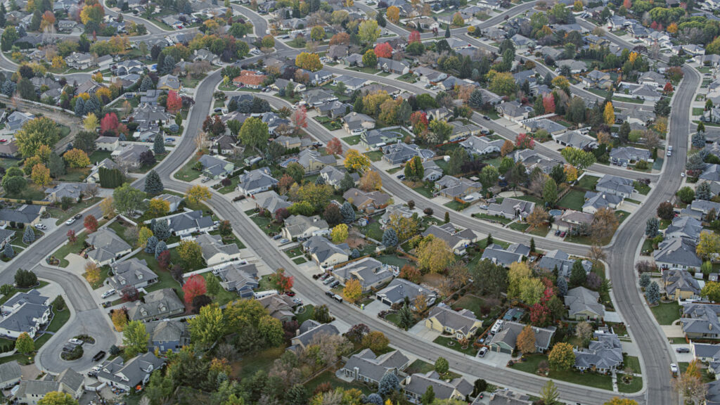 Aerial view of tract housing neighborhood during morning in Boise, Idaho, USA.