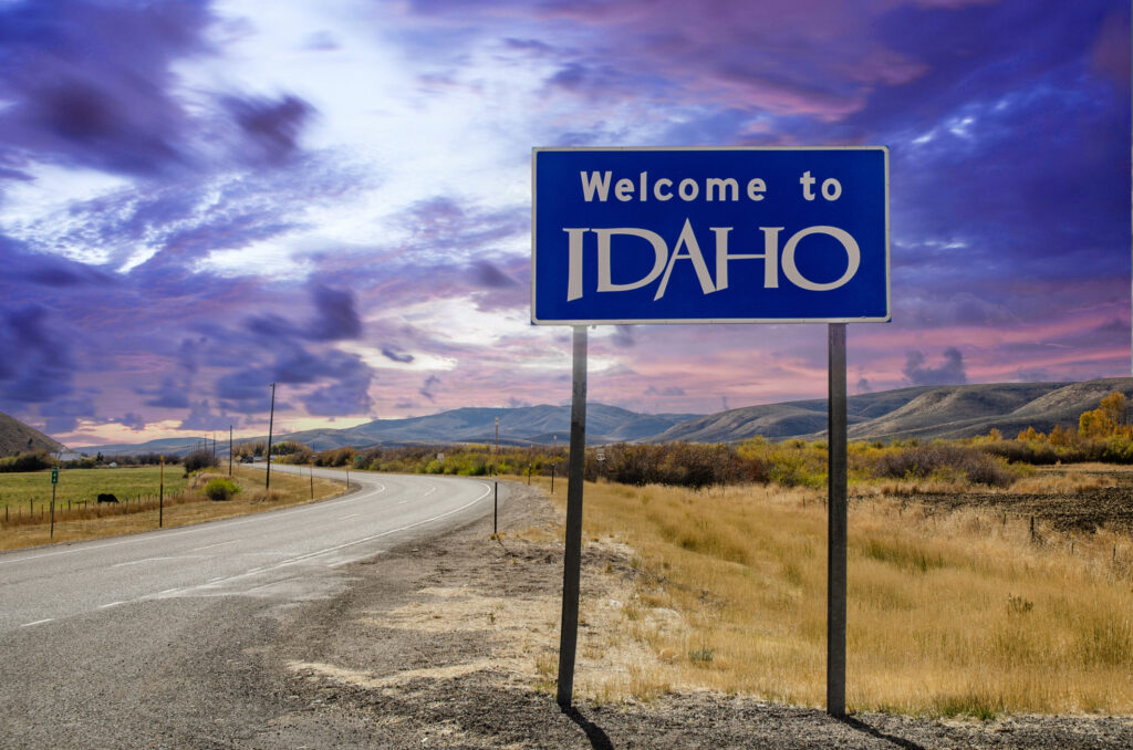 A Welcome to Idaho sign at the border of Idaho and Wyoming.