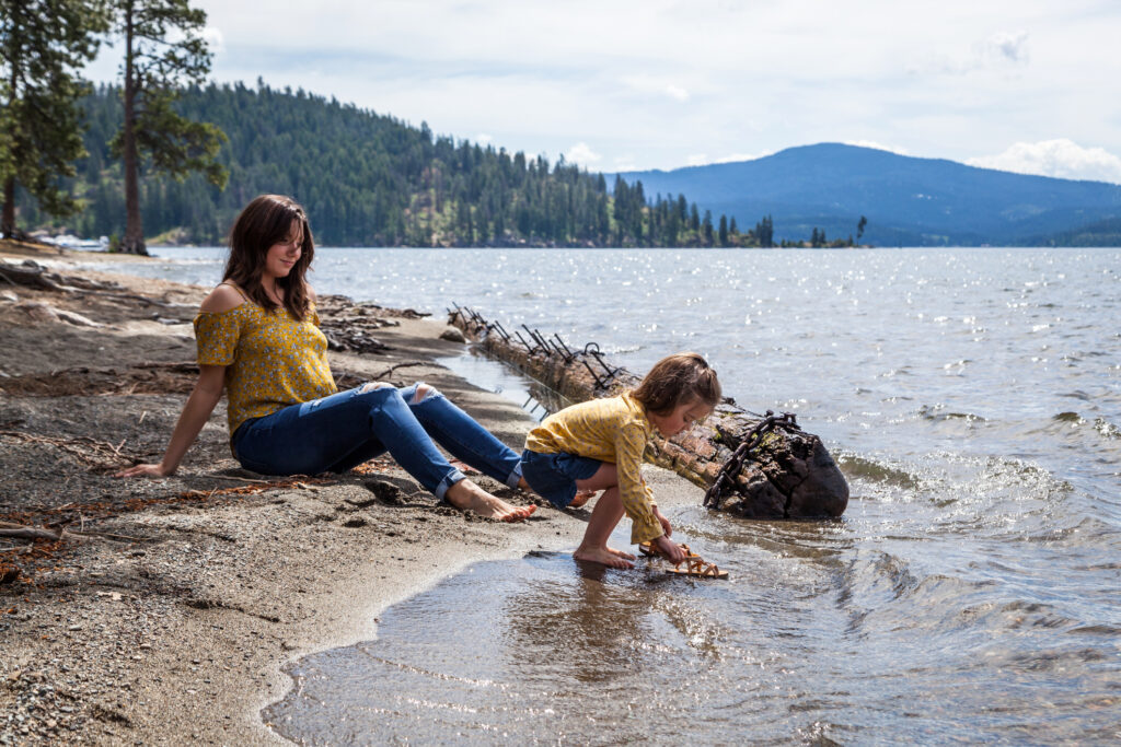 Mother and daughter with matching outfits spending the day at the beach in Coeur d' Alene Idaho