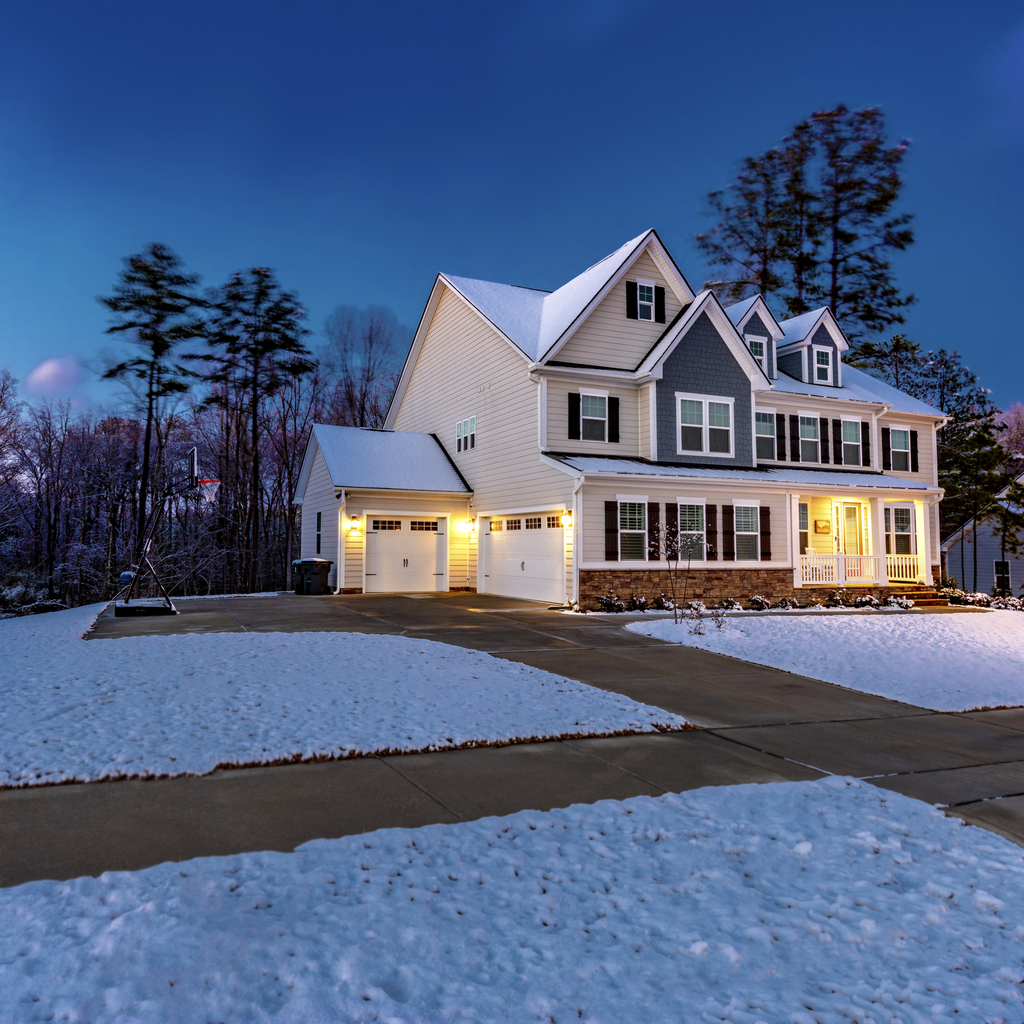 Beautiful luxury home with snow at dawn