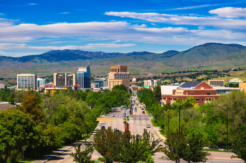 Downtown Boise, Idaho, with Capitol Blvd leading to the Idaho State Capitol building in summer.