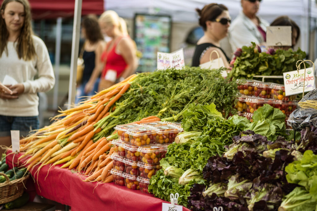 "Boise, Idaho, USA-August 11, 2012: Farmers Market in downtown. Shoppers getting ready to buy fresh produce that are locally grown"